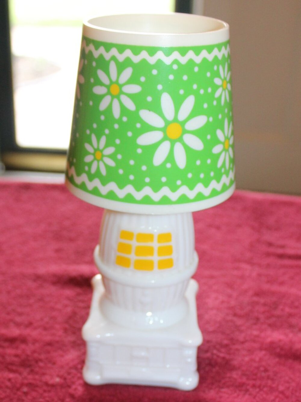 Vintage 1970s Avon cologne bottle shaped like a miniature lamp.